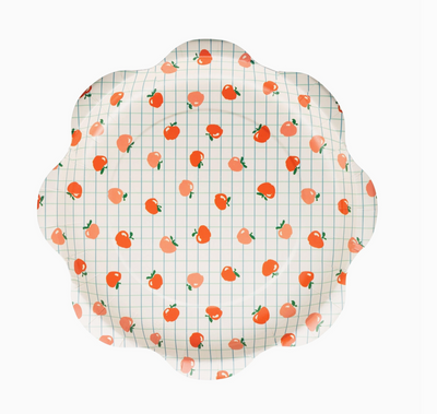 Decorative plate with peach pattern on a white background