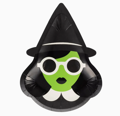 Witch-themed paper plate with a green face, black hat, and white collar on a white background
