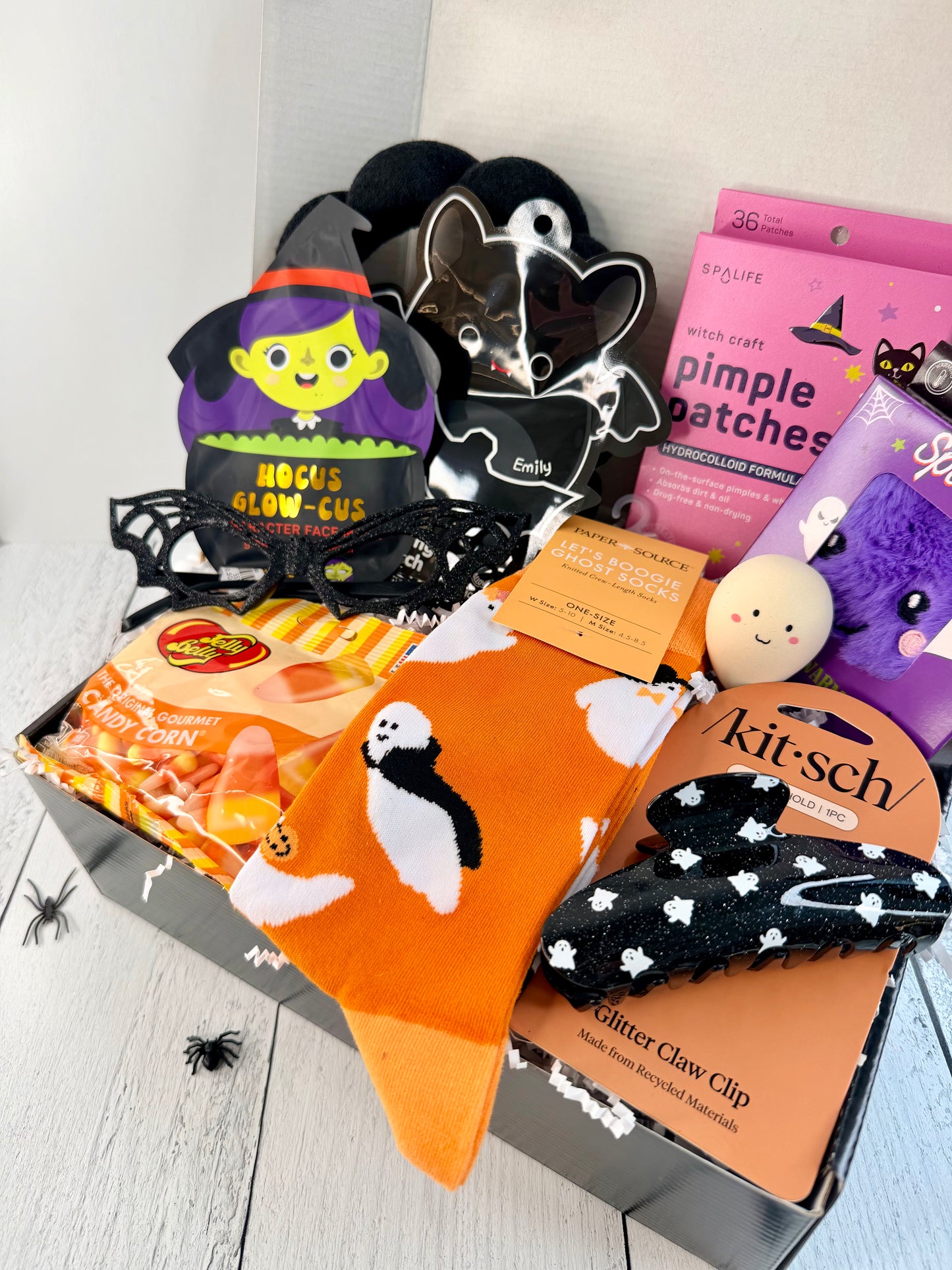 Ready-to-ship Halloween teen gift box with ghost socks, spiderweb glasses, ghost claw clip, beauty treats, hand warmer, and candy corn.