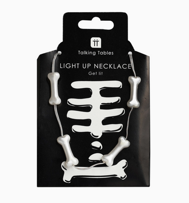 Light-up skeleton necklace in packaging with 'Talking Tables' branding.