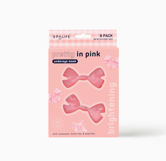 Packaging of Pretty in Pink brightening undereye masks with two masks visible through the transparent window, designed in a bow shape on a pink background.
