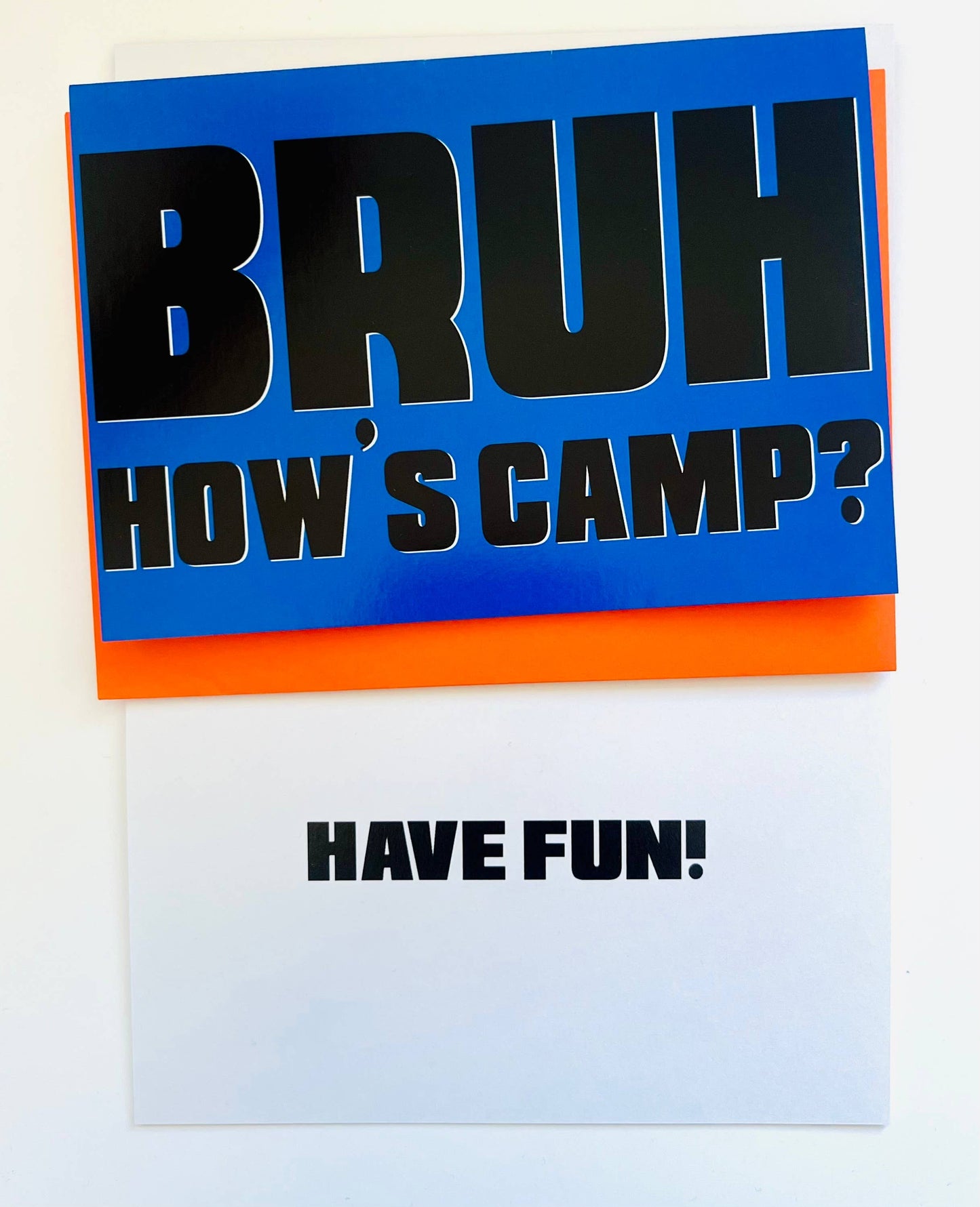 Card with 'BRUH HOW'S CAMP?' text on a blue and orange background, with a white card below.
