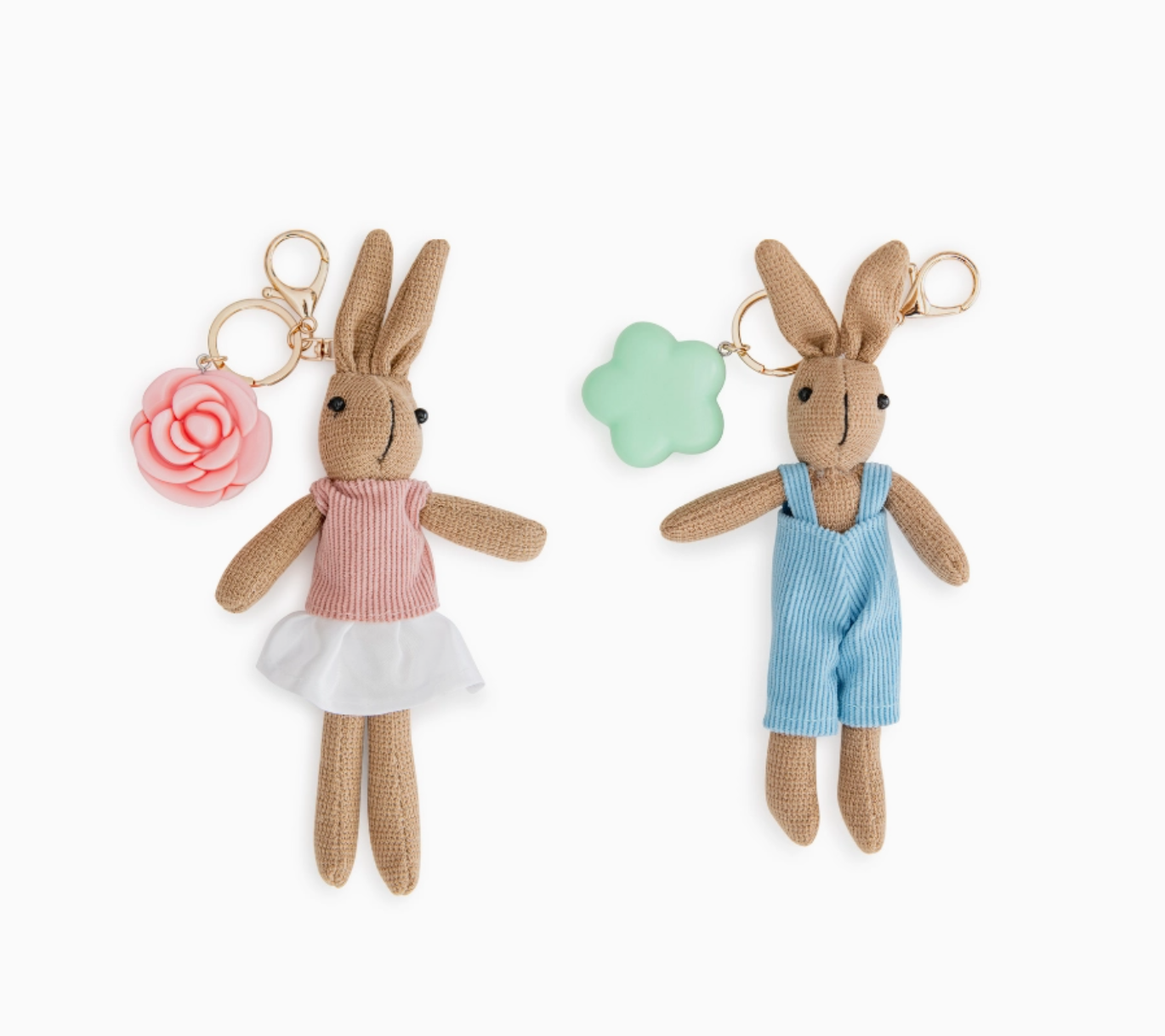 Two plush rabbit keychains, one in a dress and one in overalls, on a white background.
