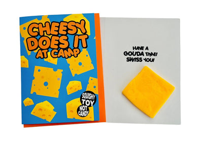 Cheesy toy packaging with a block of cheese on a white background