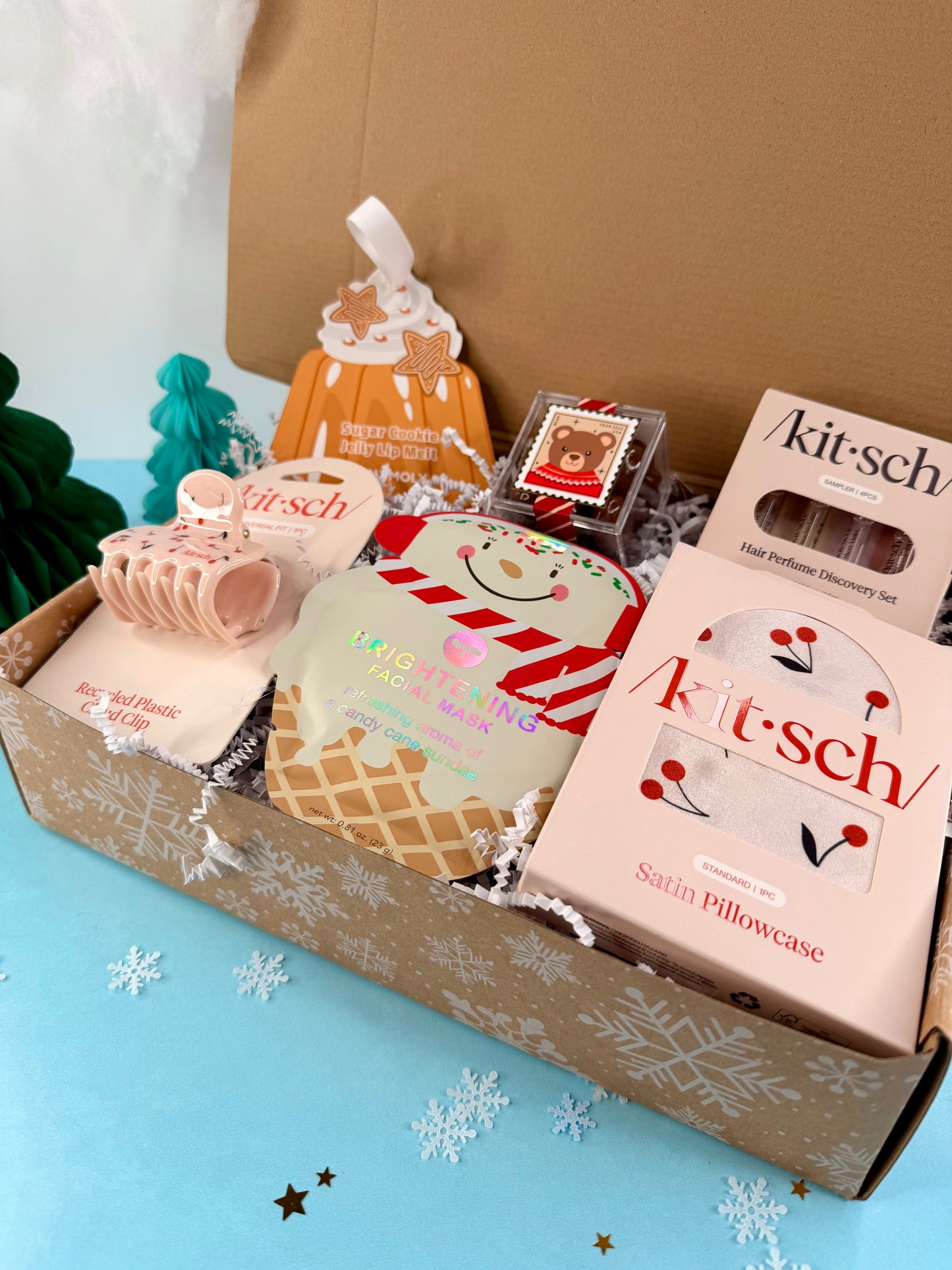 Kitsch product packaging on a blue surface with decorative elements