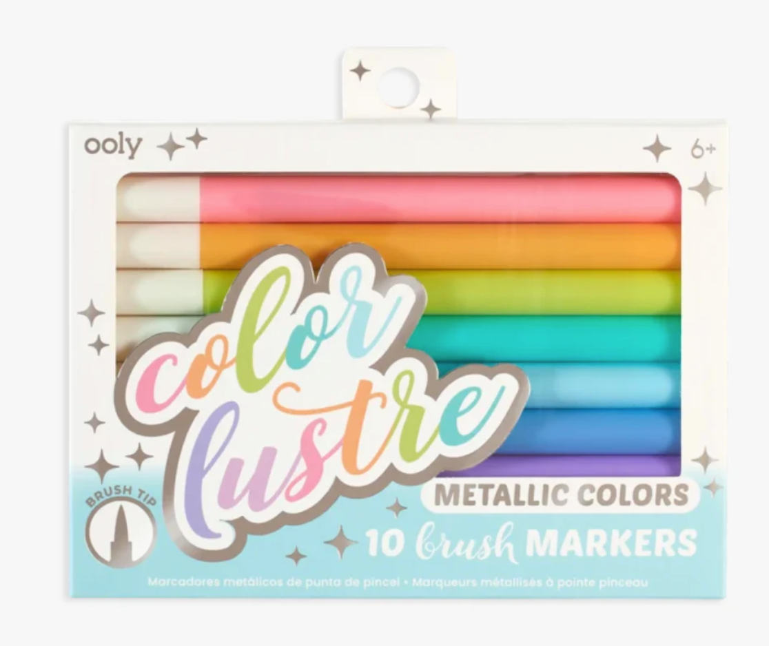 Packaging of Ooly Color Lustre metallic brush markers with colorful design.