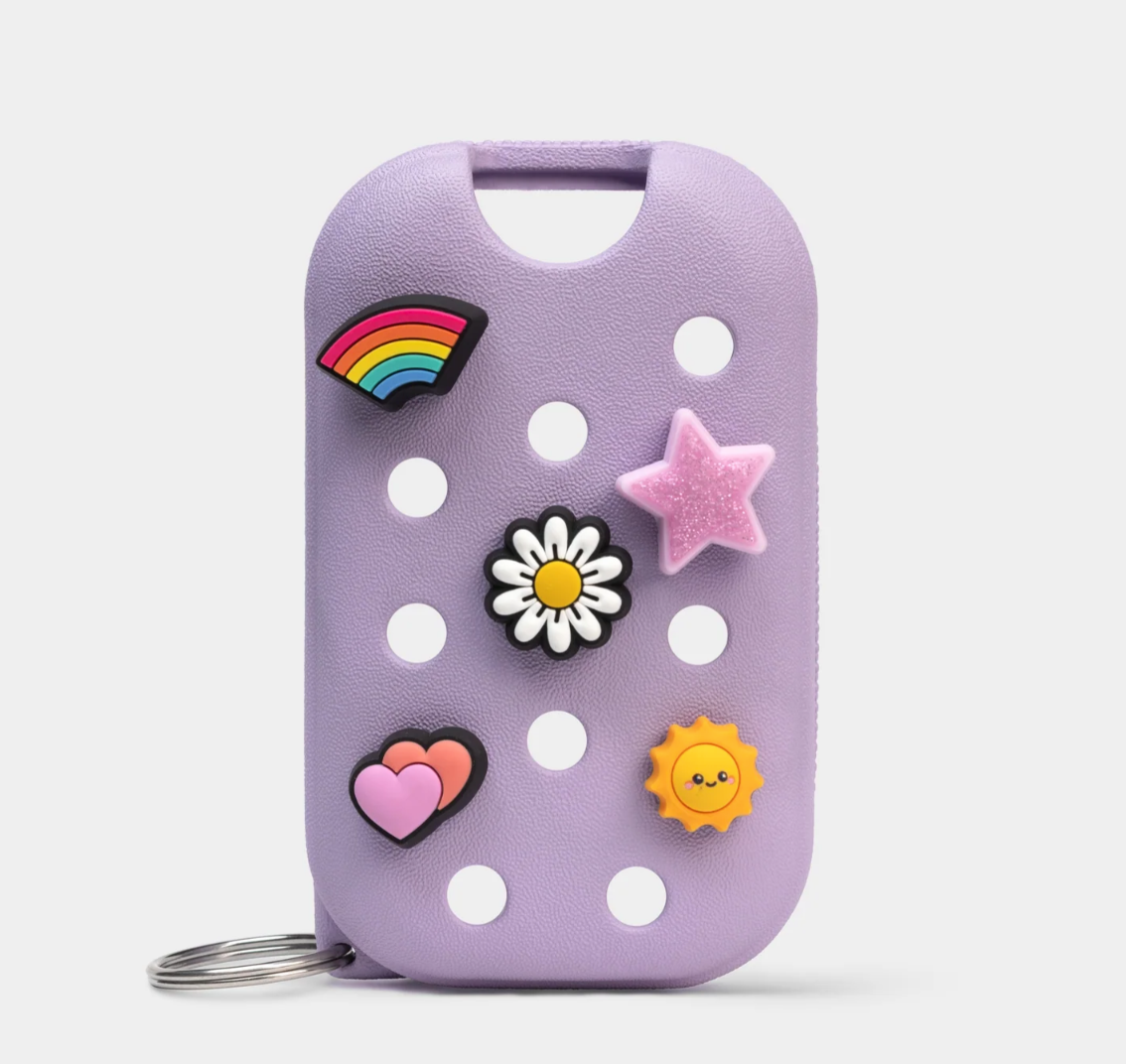 Purple pouch with colorful decorative pins on a white background