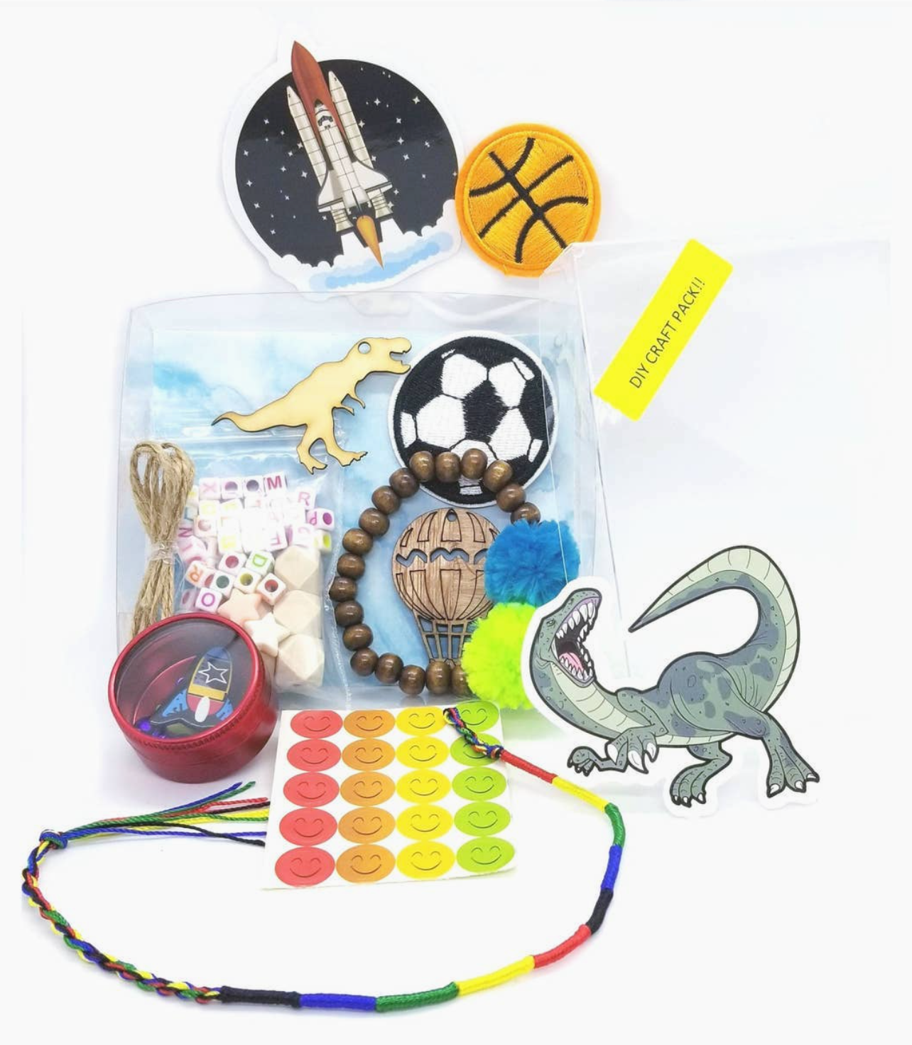 Assorted children's toys and craft items including a beaded necklace, dinosaur figurine, and sports balls on a white background.