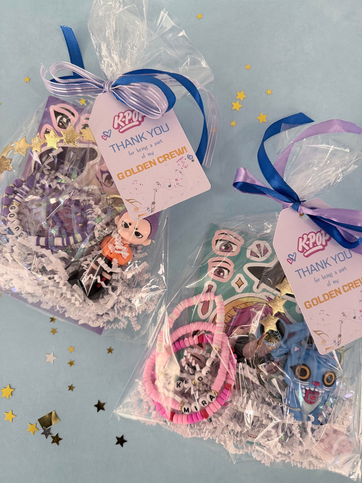 Two packages of decorative items with ribbons and 'Thank You' tags on a light blue background.