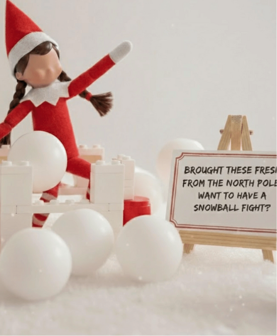 Elf on the Shelf with snowballs and a sign asking for a snowball fight, branded 'Ellie's Party Supply'.