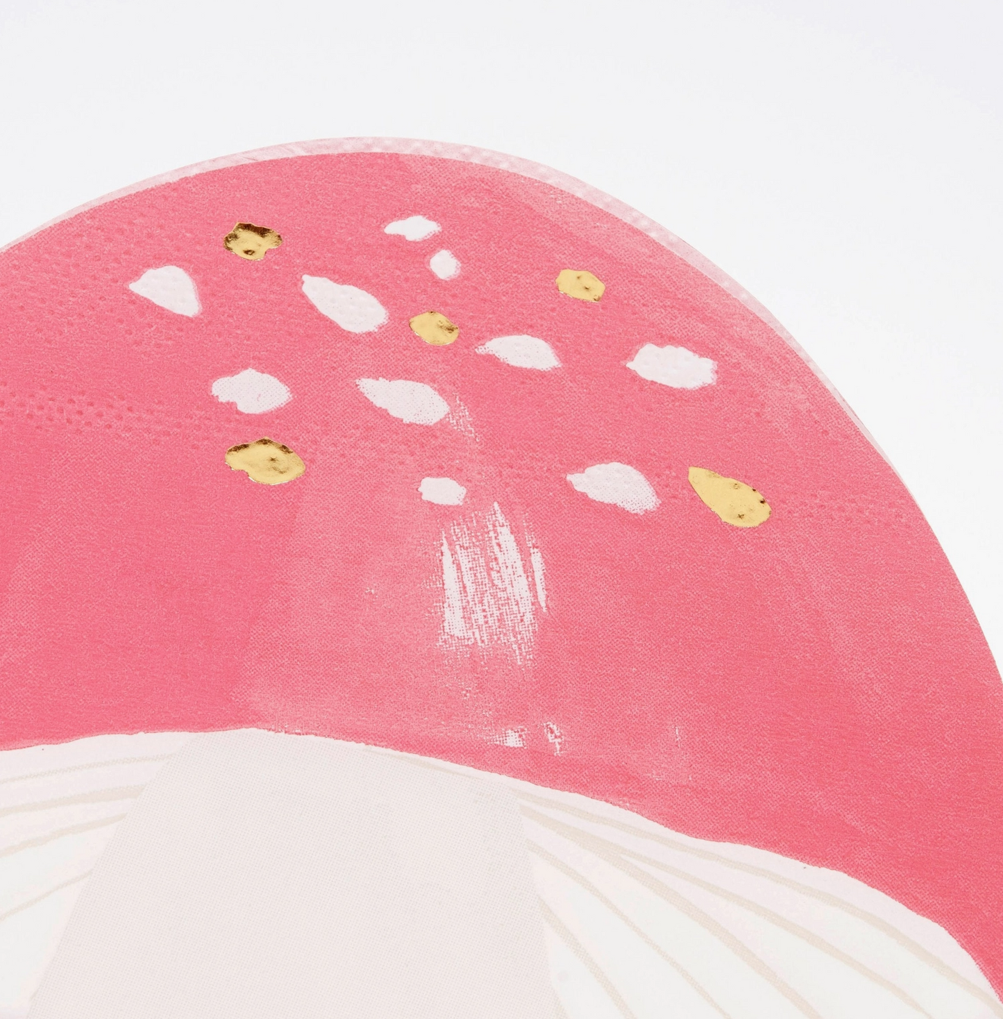 Close-up of a pink and white hat with decorative elements on a white background