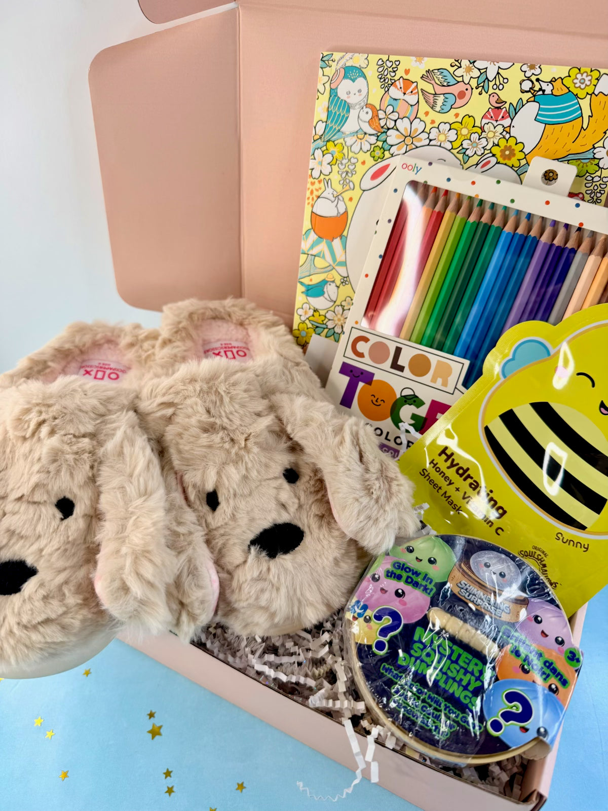 Ready-to-ship tween gift box with plush animal slippers, coloring book, colored pencils, sheet mask, and mystery squishy toys