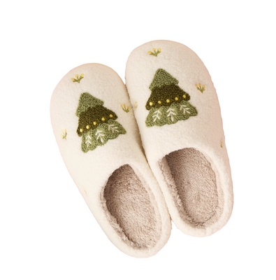 Pair of slippers with Christmas tree design on a pink background