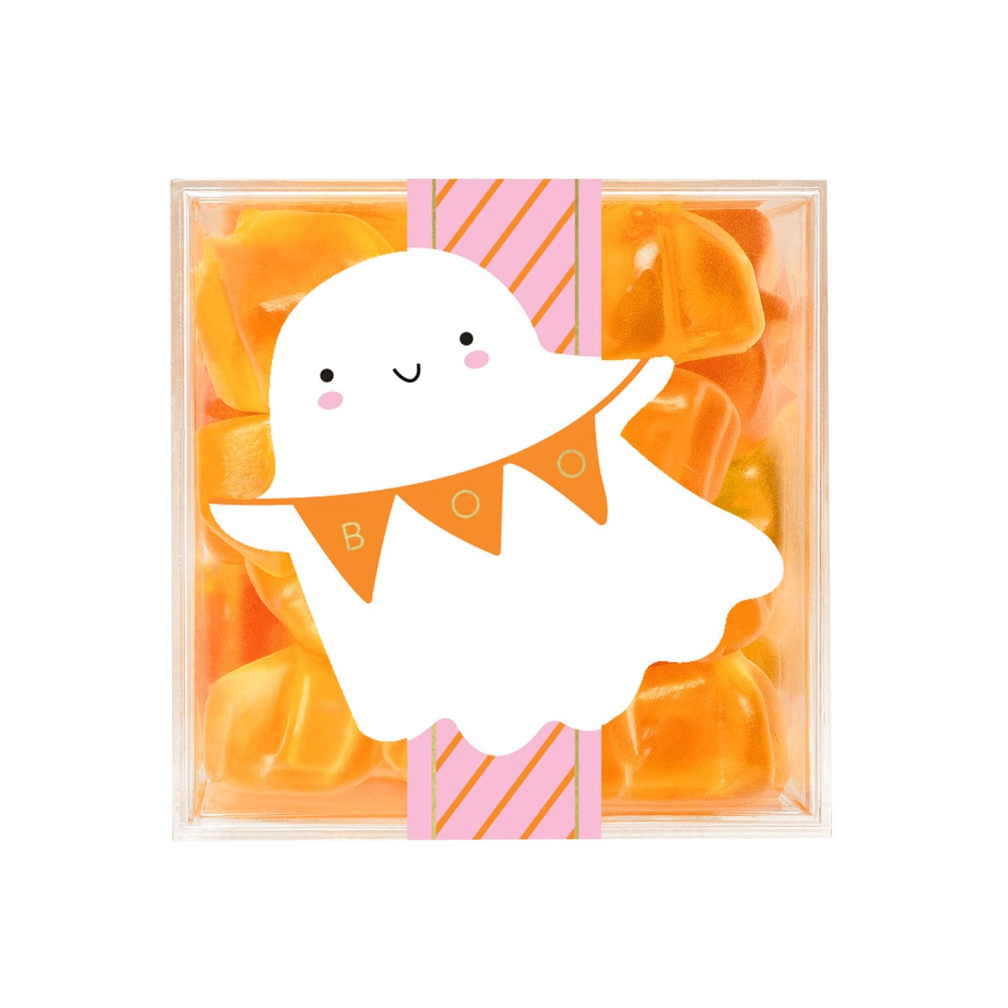 A clear square gift box filled with orange translucent gummy candies, wrapped with a pink and orange striped paper band and a large white cartoon ghost decoration with an orange pennant banner.