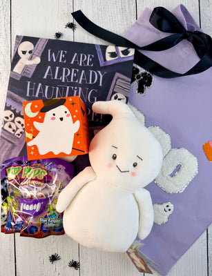 Ghostly Gifts Boo Bag with a lavender BOO tote, white ghost plush, Halloween lollipop, ghost-themed surprise, and spooky card.