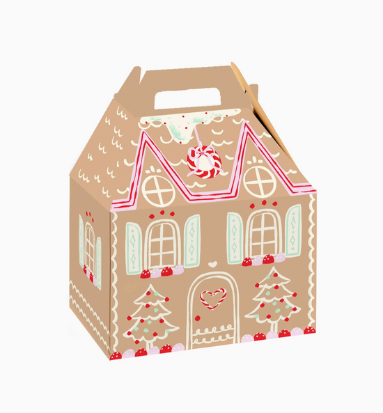 Gingerbread house-shaped gift box with decorative elements on a white background