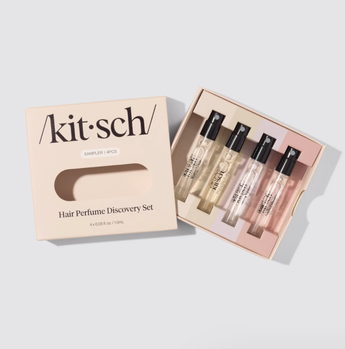 Kit-sch hair perfume discovery set with packaging on a light gray background