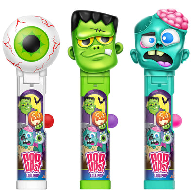 Three Pop-Ups! Lollipops with Halloween zombie designs, including an eyeball lollipop, Frankenstein's monster, and a green-skinned zombie, shown on a plain white background.