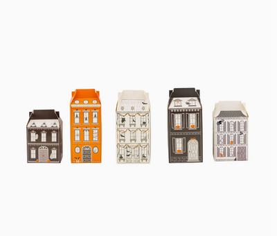 Set of miniature house-shaped boxes on a white background