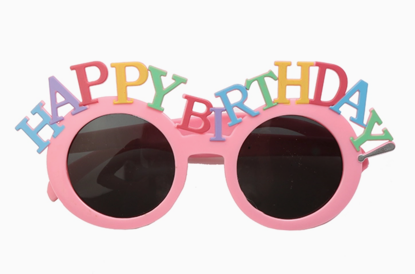 Pink sunglasses with 'Happy Birthday' letters on a white background