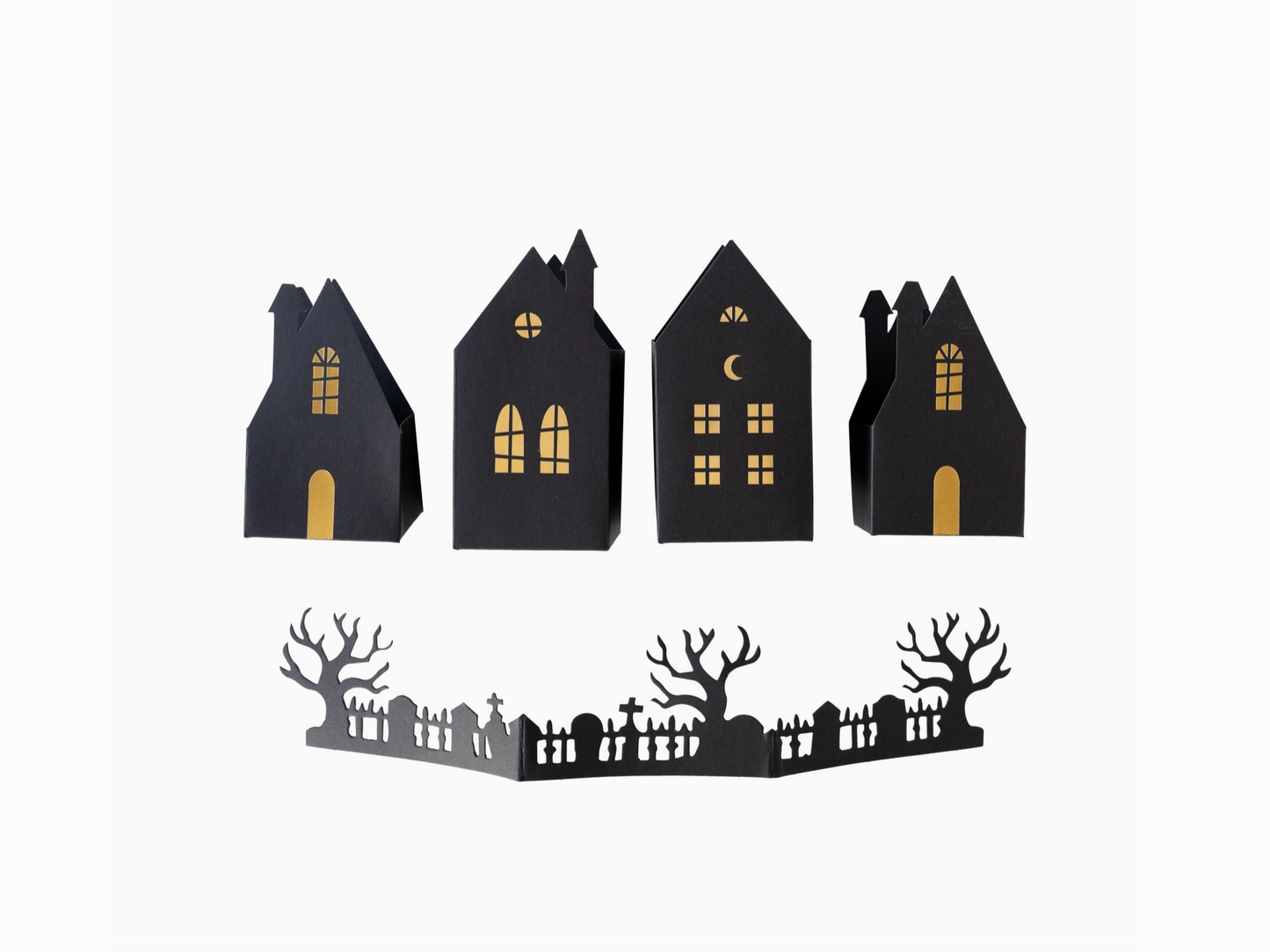 A set of three-dimensional black houses with gold foil accents and a fence, designed for Halloween tabletop decoration.