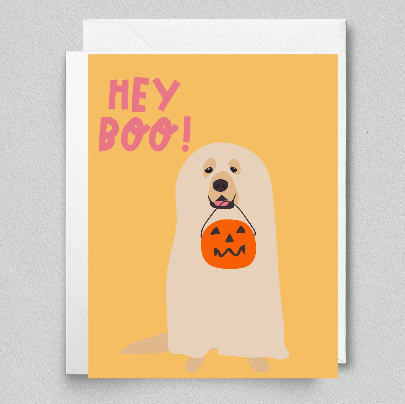 A Halloween card featuring a cartoon depiction of a dog in a costume holding a pumpkin, with the text 'Hey Boo!' on top.