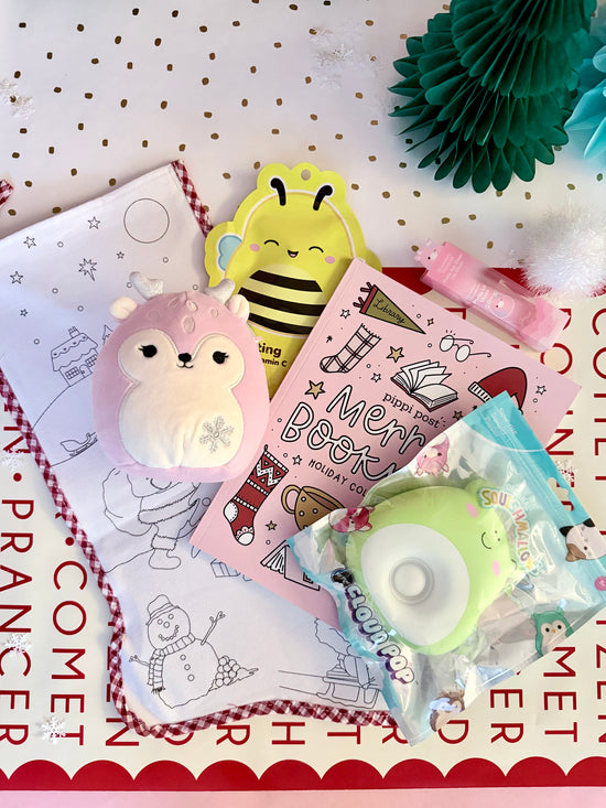 Set of stationery items including a pink notebook, a yellow bee-shaped bookmark, and a green eraser on a white background with text.