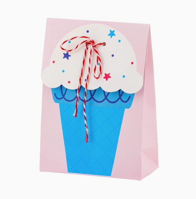 A treat bag designed to look like an ice cream cone, with blue 'ice cream' and a pink 'cone' shape, decorated with red and white stars and a red bakers twine bow.