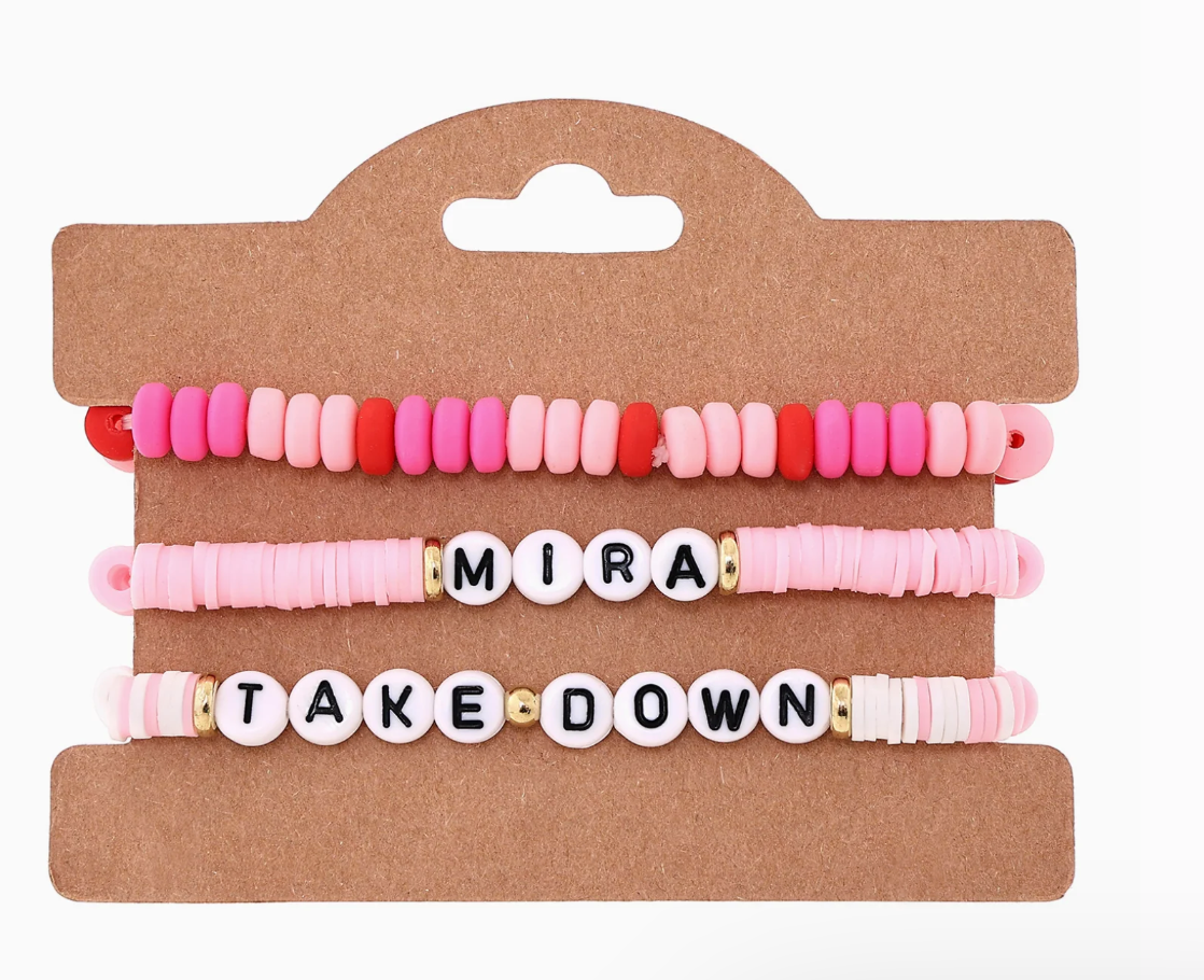 Set of colorful beaded bracelets on a cardboard holder with 'MIRA TAKE DOWN' text.