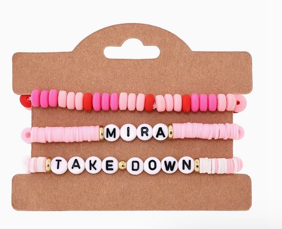 Set of colorful beaded bracelets on a cardboard holder with 'MIRA TAKE DOWN' text.