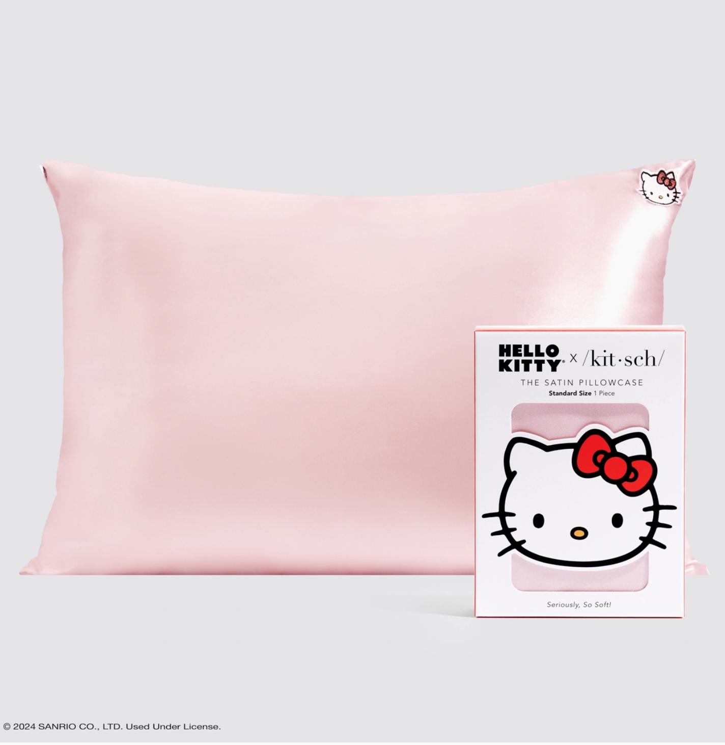 Pink satin pillowcase with Hello Kitty branding on a light gray background