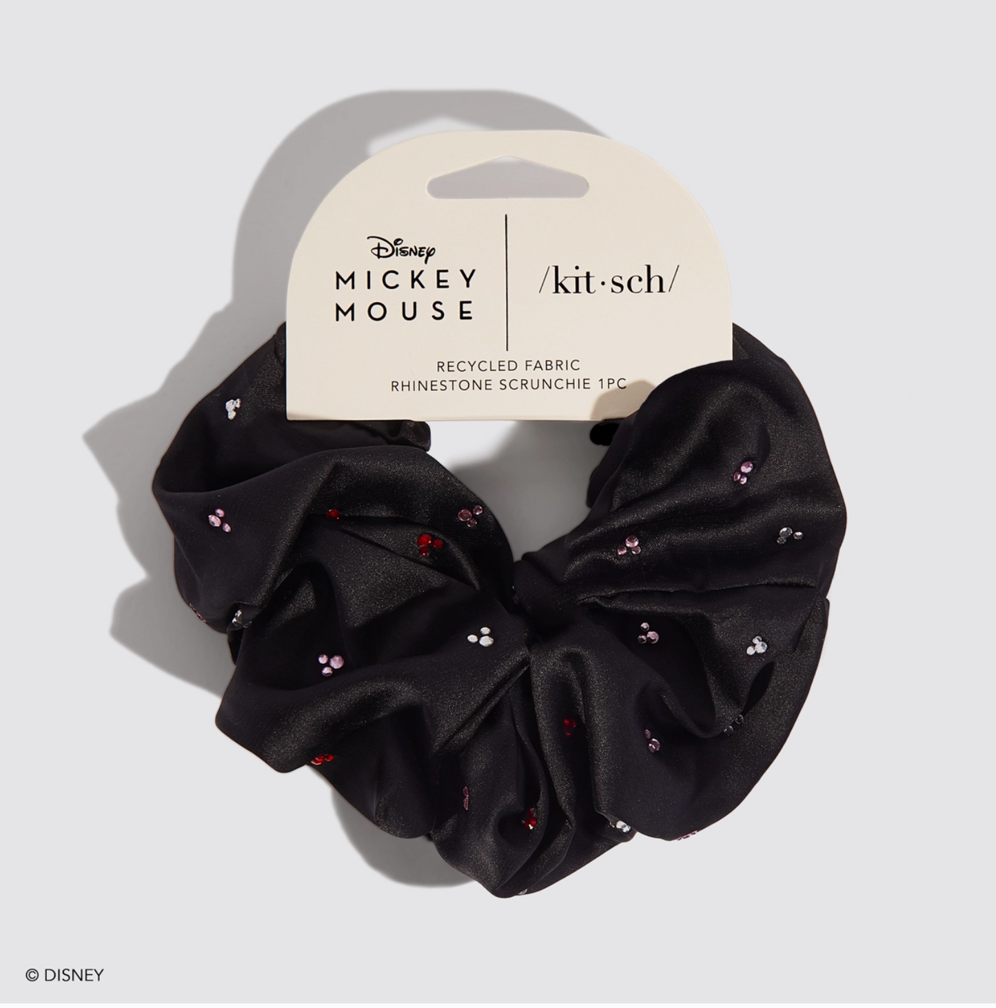 Black scrunchie with rhinestones on a white background, featuring Disney Mickey Mouse branding.