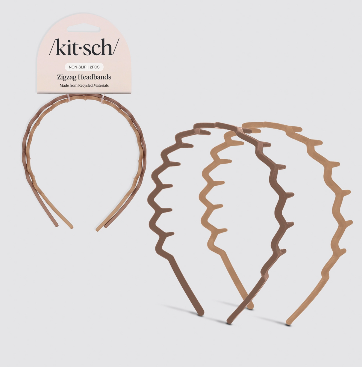Two zigzag headbands with packaging labeled 'kitsch' on a light gray background
