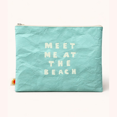 Turquoise pouch with 'Meet Me at the Beach' text on a white background