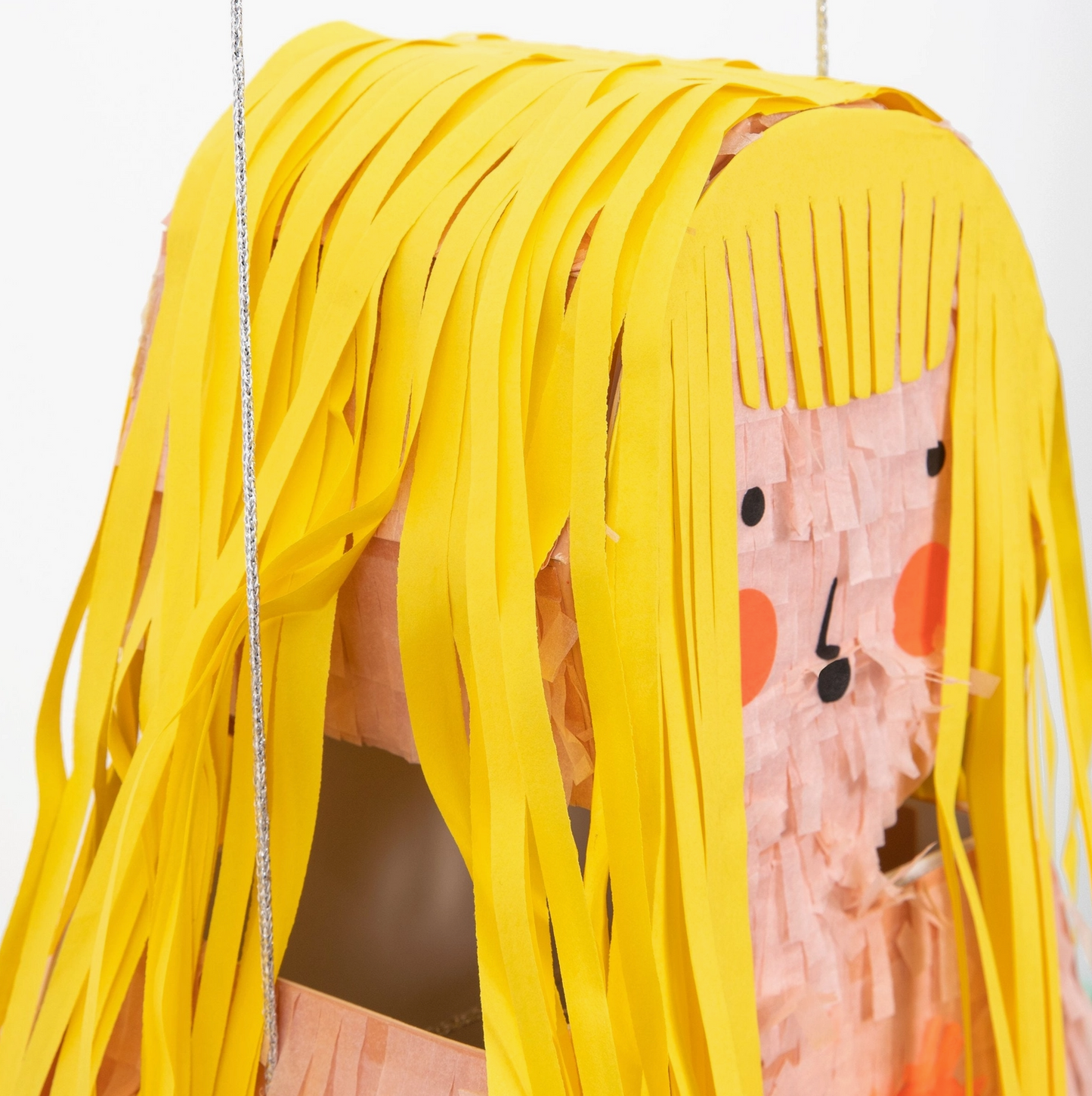 Person wearing a costume with yellow hair and a pink headband with black details.