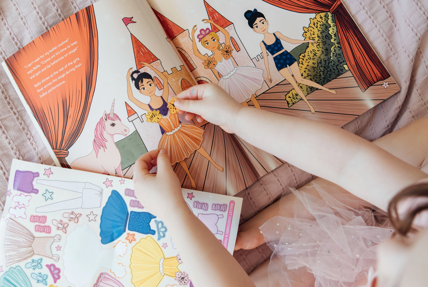 Children's dress-up paper dolls with colorful dresses and accessories.