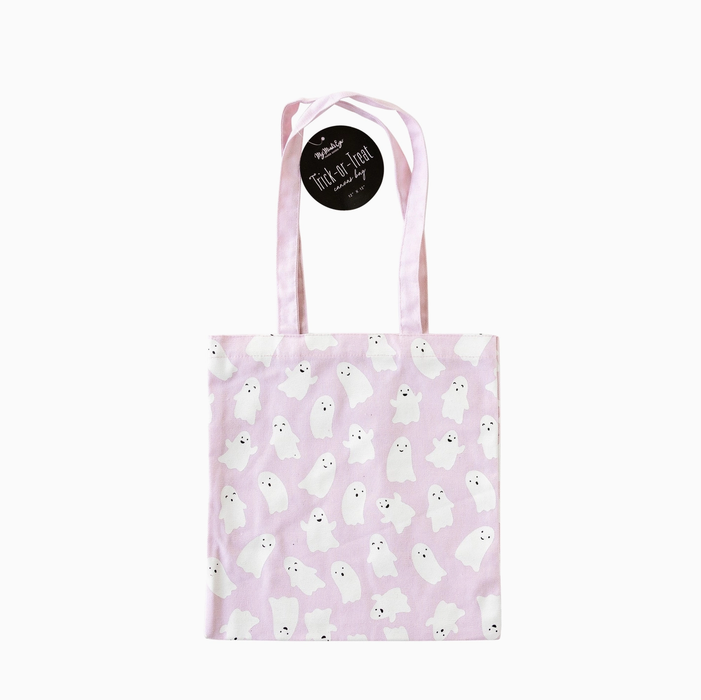 A pink canvas trick or treat bag with a screen printed design of white ghosts and text that reads 'Trick or Treat'. The bag has handles and a black label with the brand name 'My Mind's Eye'.