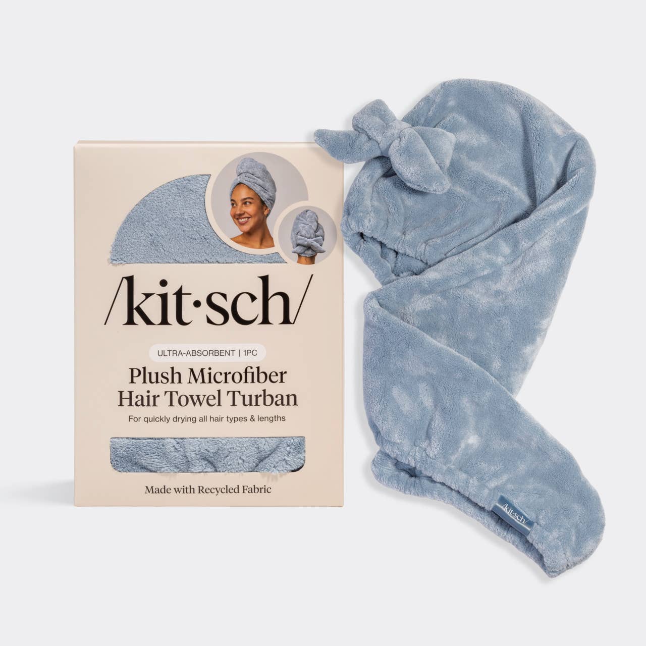 Blue plush microfiber hair towel turban with packaging on a white background