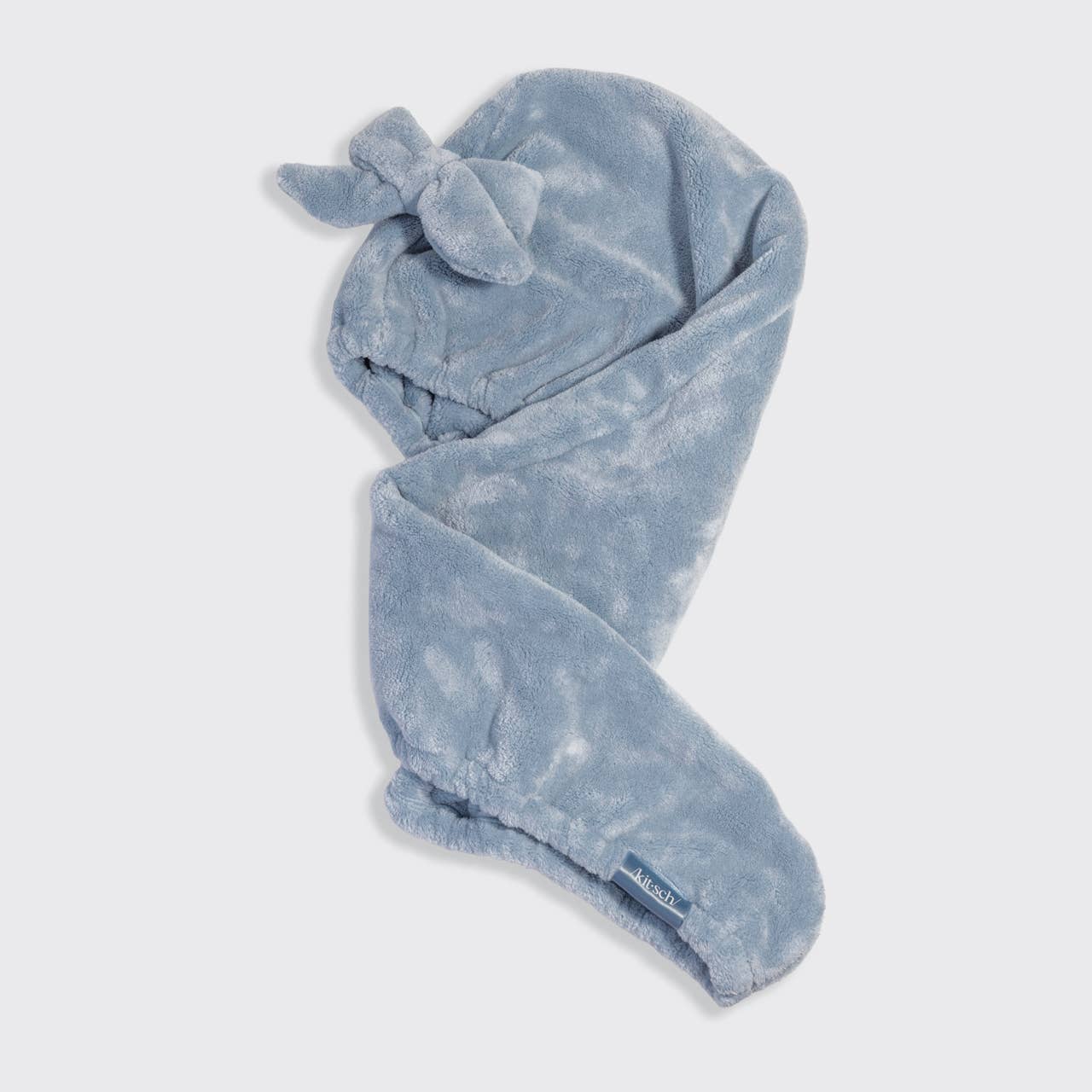 Blue towel with a bow on a white background
