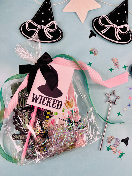 Packaged product with witch hat design and 'Wicked' text on a light blue background