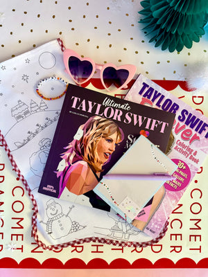Taylor Swift coloring book with sunglasses and coloring sheets on a polka dot surface