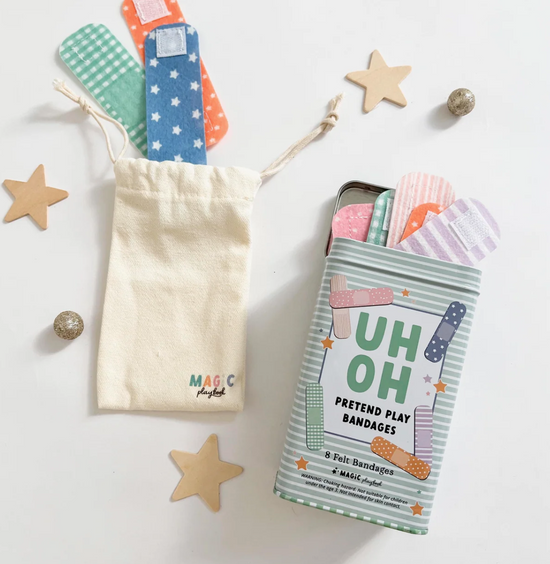 Pretend play bandages in a pouch with packaging on a white background