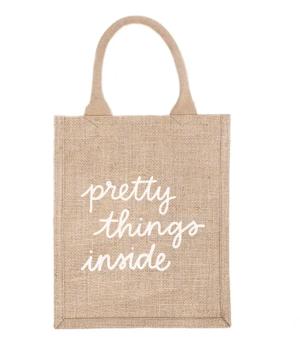 Jute bag with 'pretty things inside' text on a white background