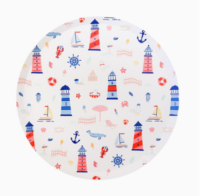 Round plate with nautical-themed pattern featuring lighthouses, anchors, and boats on a white background.