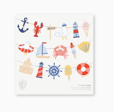 Set of beach-themed party decorations on a white background