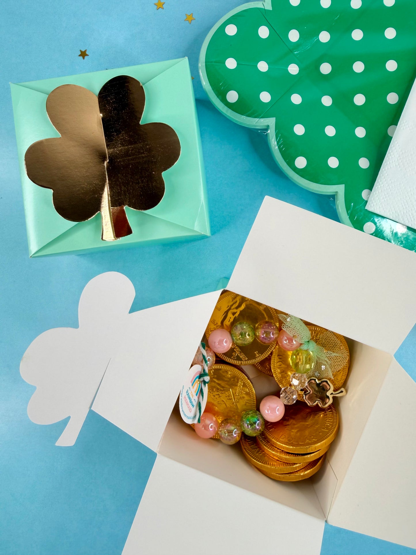 Decorative box with gold coins and decorative elements on a blue background