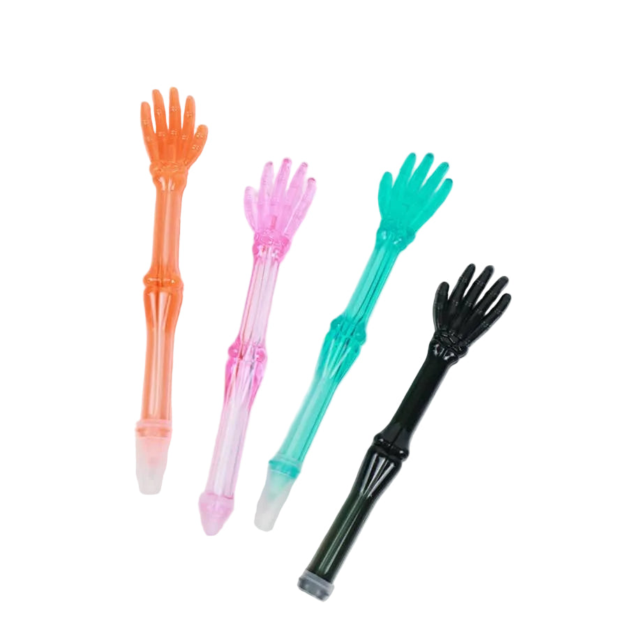 Four novelty pen-shaped objects shaped like skeletal hands, shown in translucent orange, pink, teal, and black on a white background.
