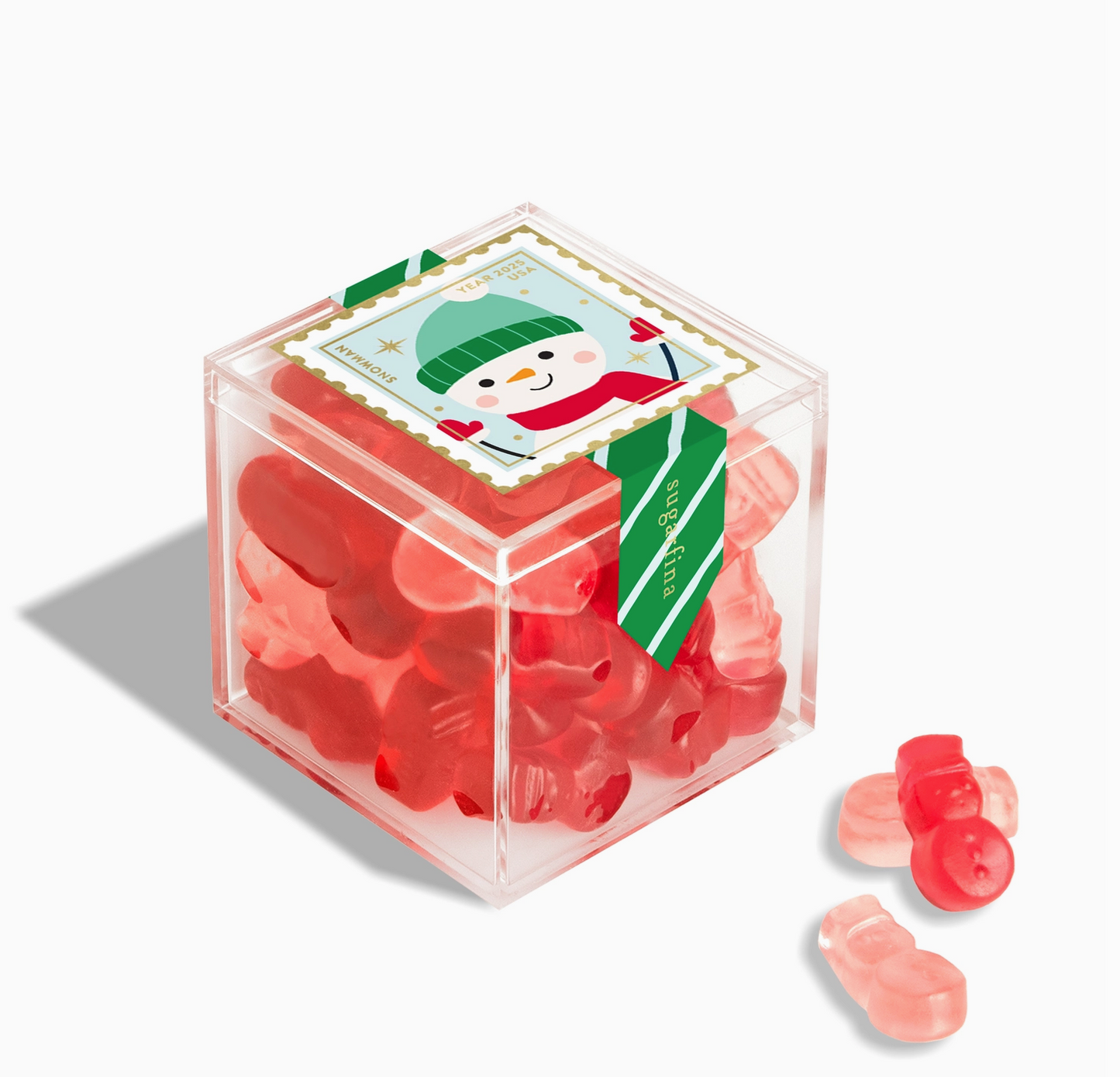 Clear cube container filled with red gummy bears with a snowman label on a white background