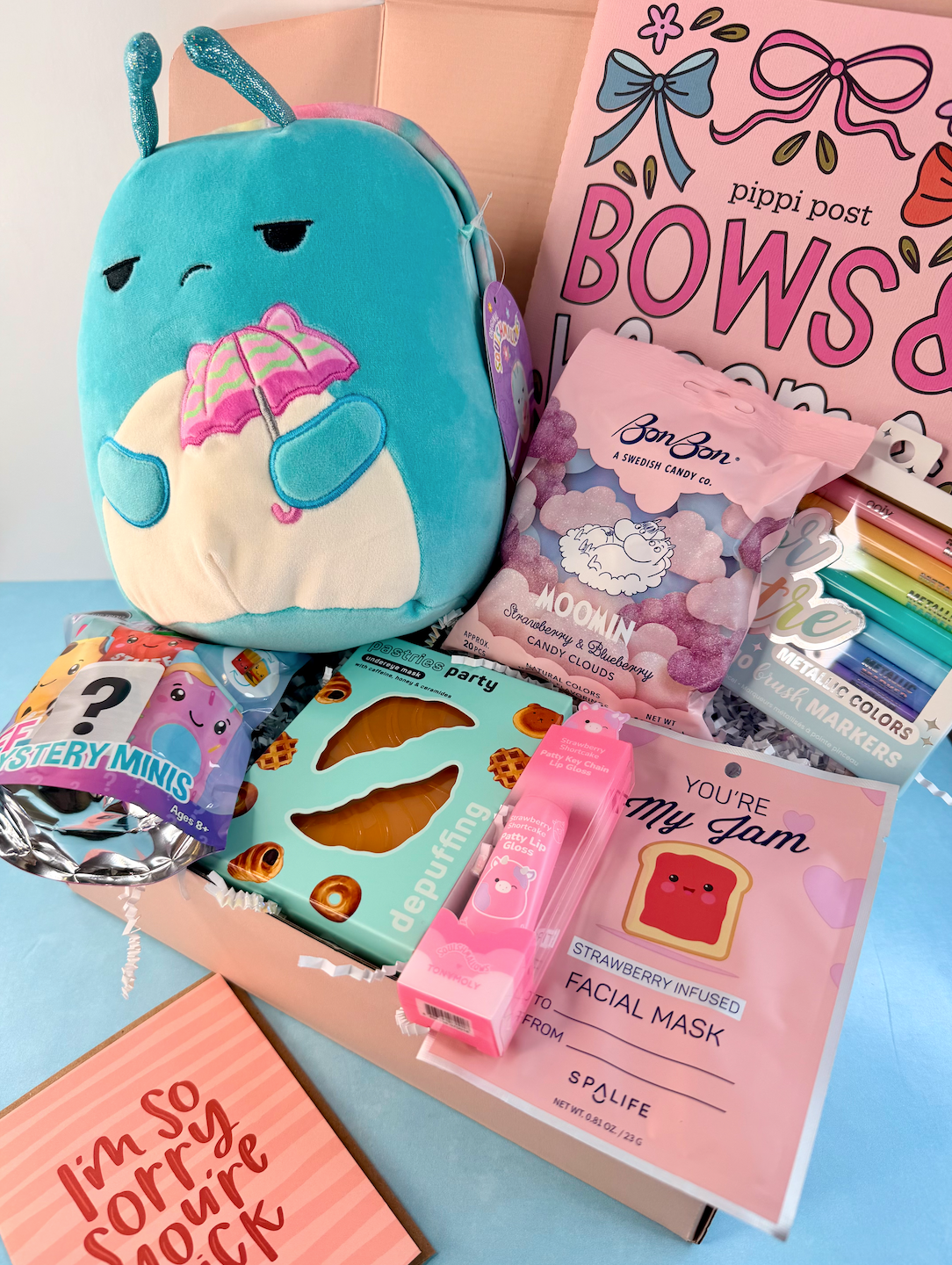 Get well gift box for tweens with blue plush, coloring book, metallic markers, game, candy, lip gloss, and facial mask