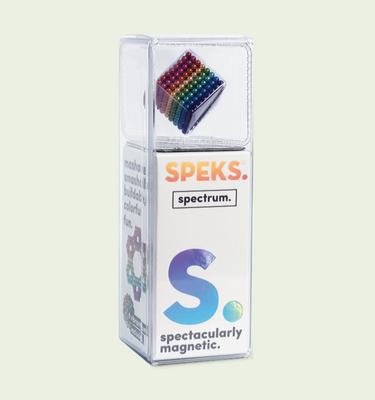 Speks spectrum magnetic product packaging on a light beige background